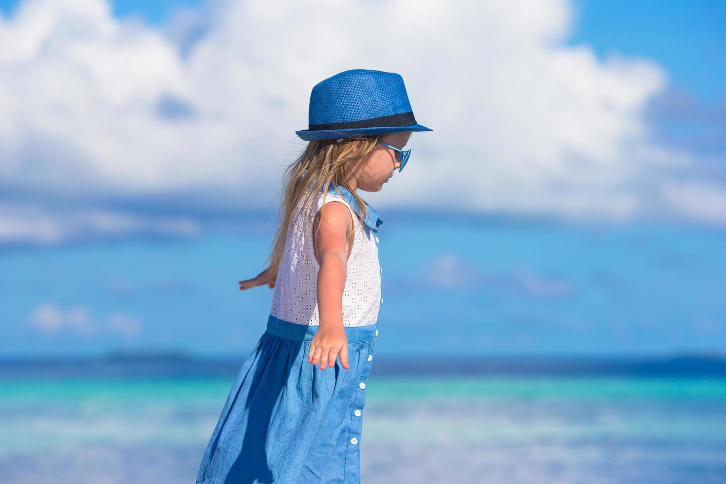 Girl having fun on a beach photo