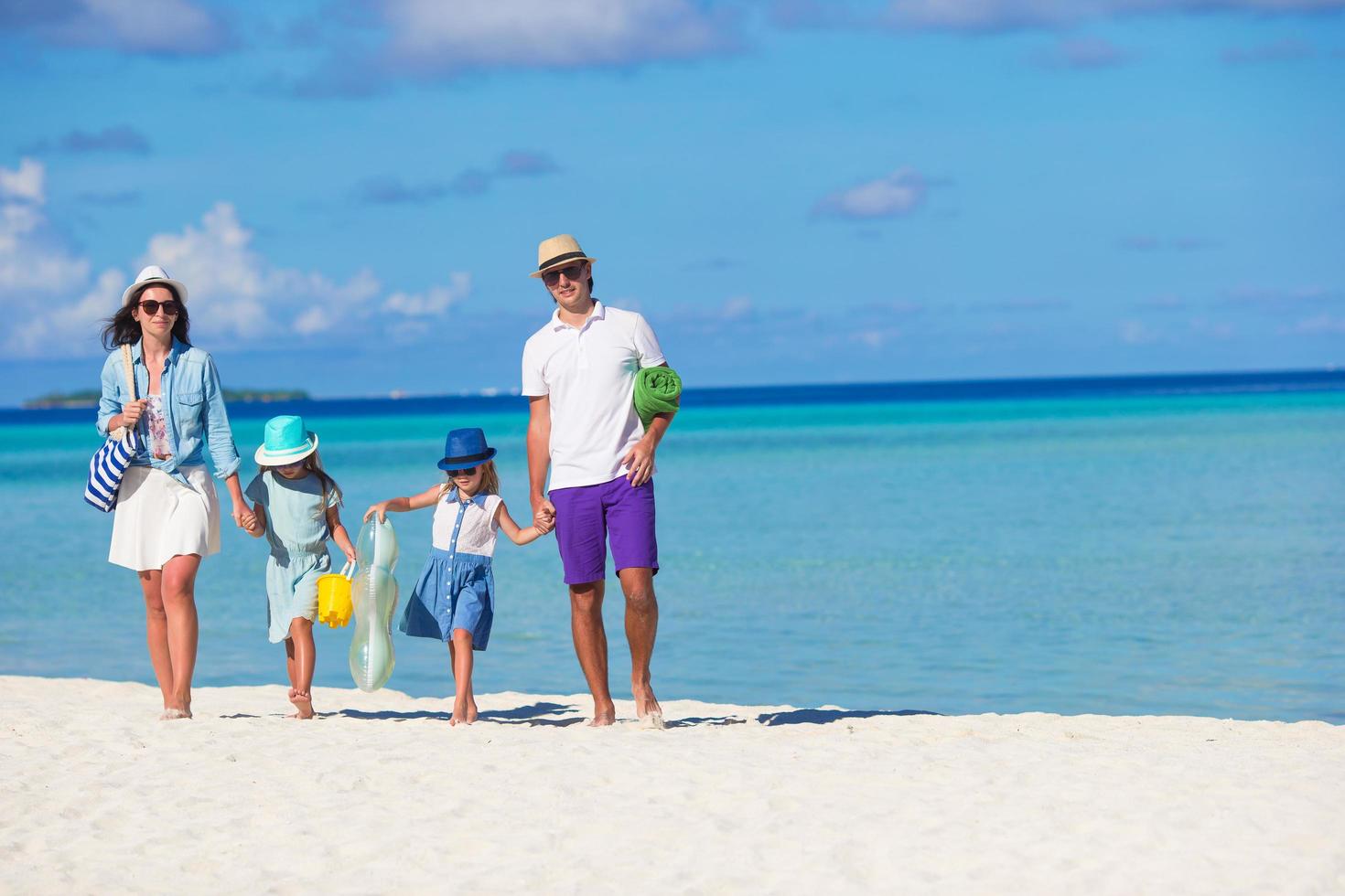 Family on vacation on a beach photo