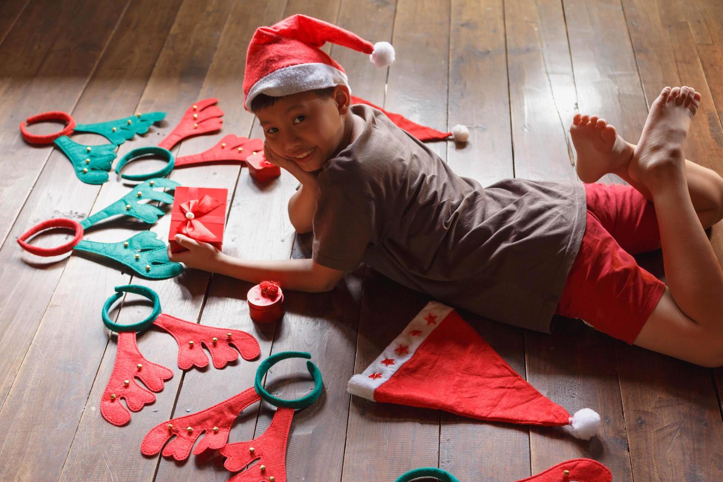 Boy with gift box on Christmas day photo