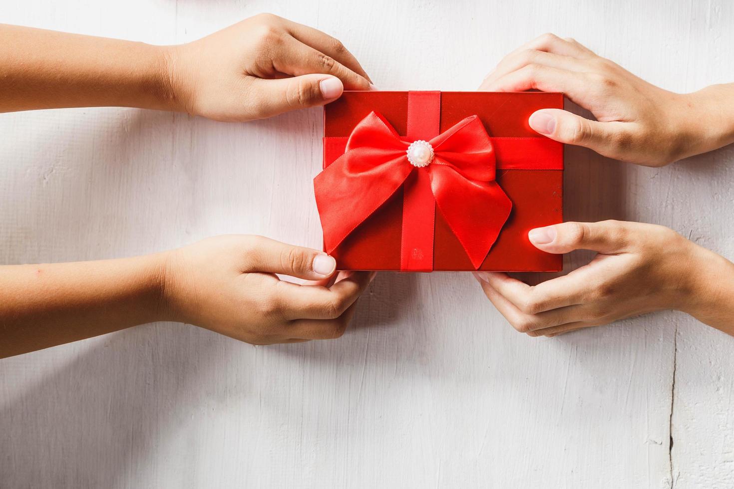 Two people fighting over a gift photo