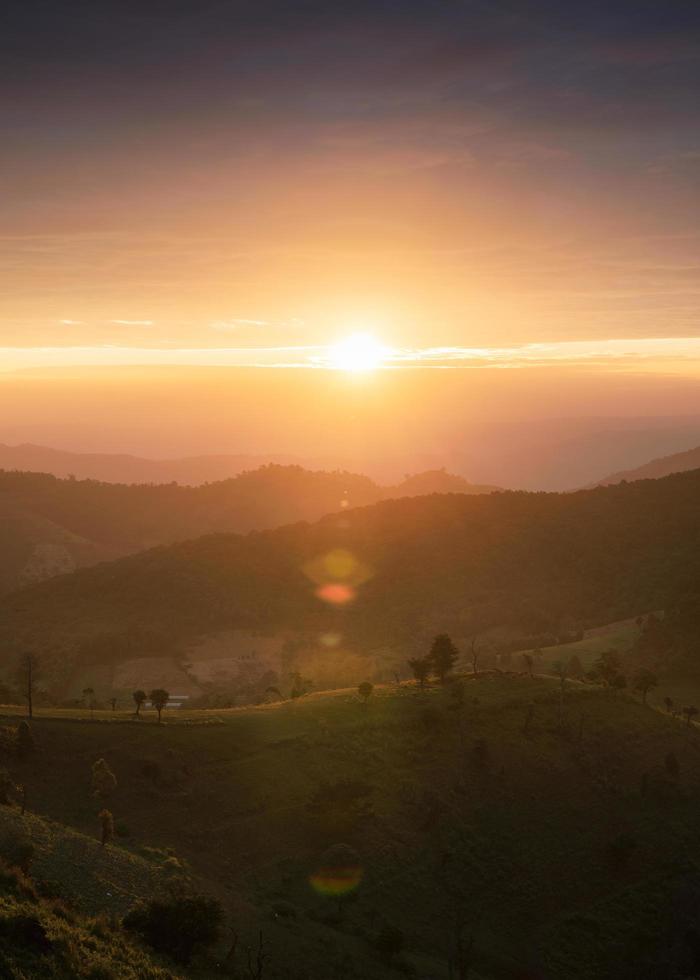 Sunrise over a hill in countryside at Doi Mae Tho photo