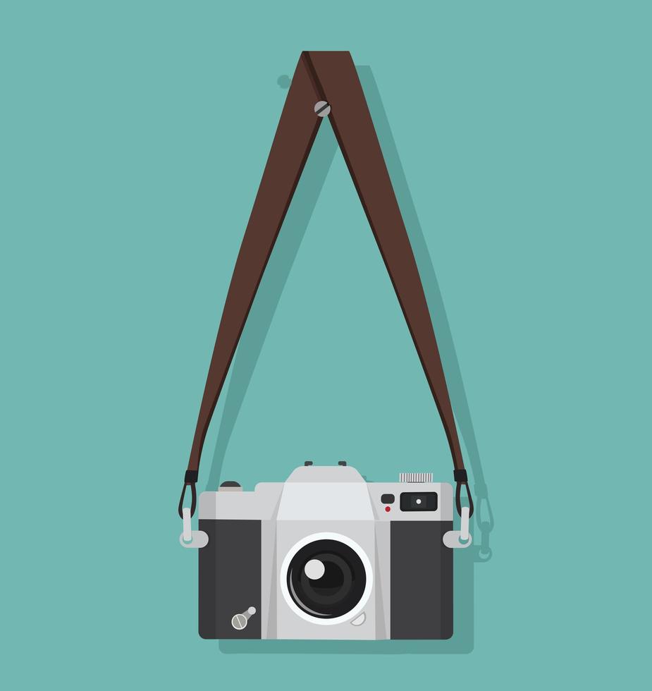 Vintage photography camera hanging on a strap vector