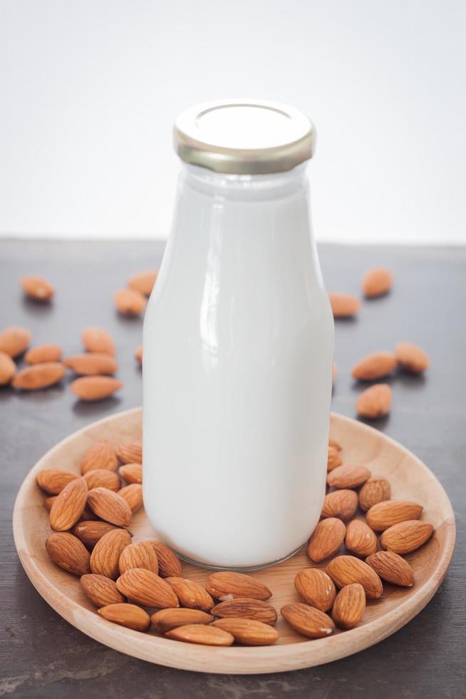 Almond milk in almond nuts photo