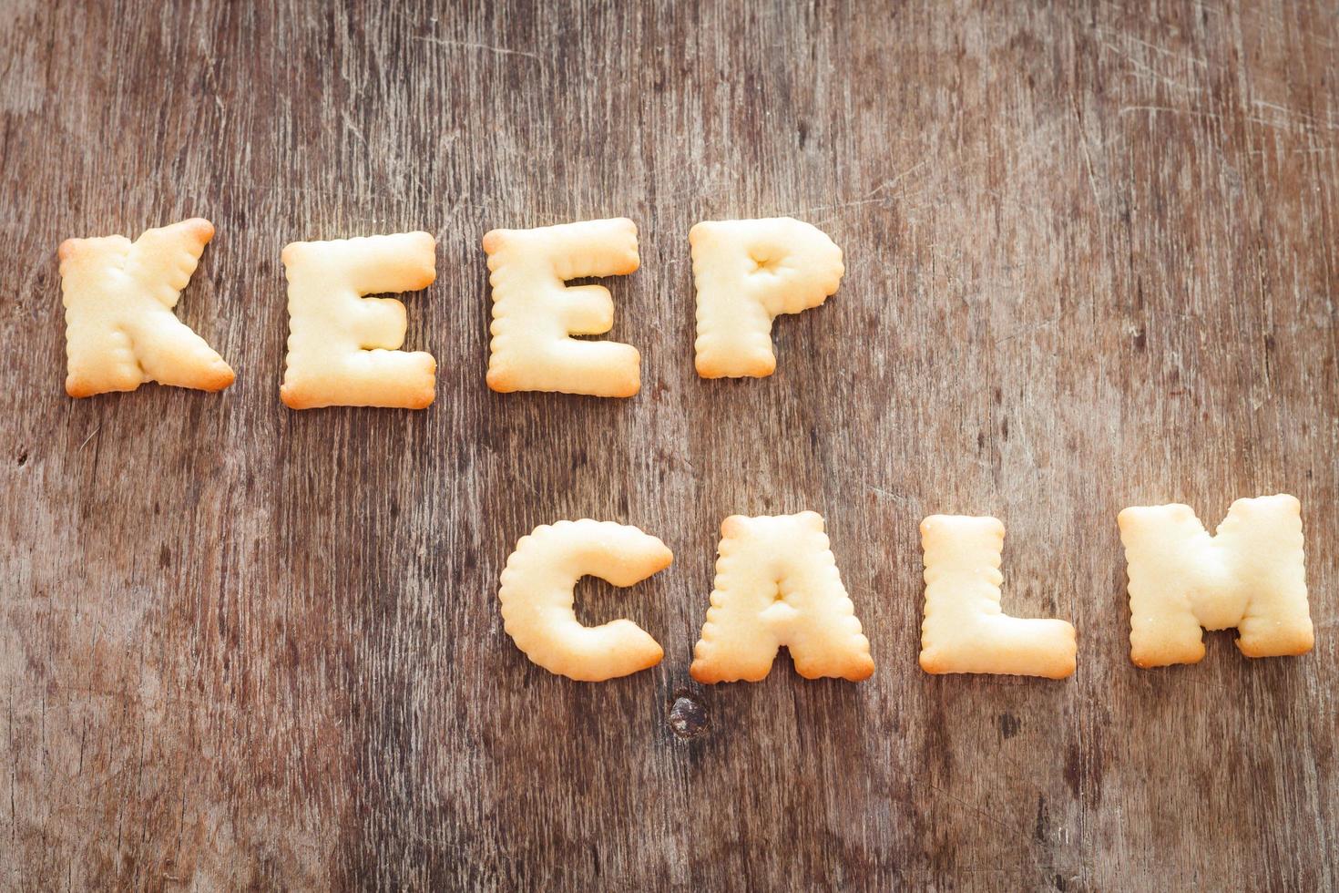 Keep calm alphabet biscuits on a wooden table photo