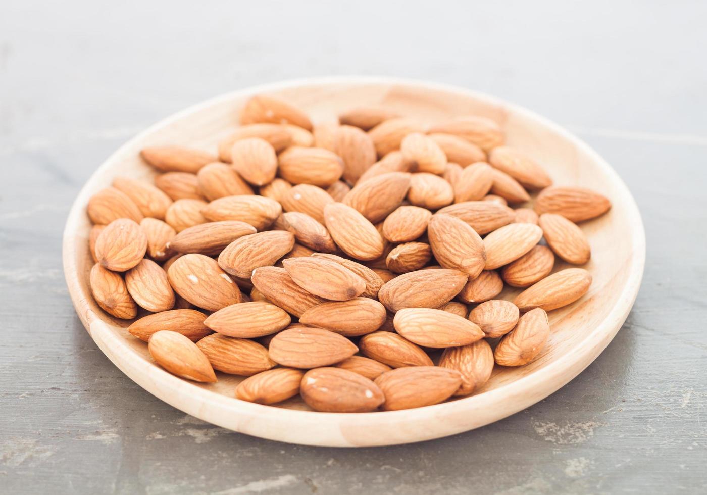 Almond nuts on a plate photo