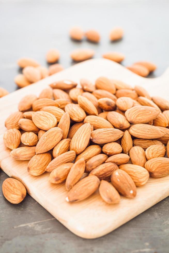 Almond nuts on a wooden board photo