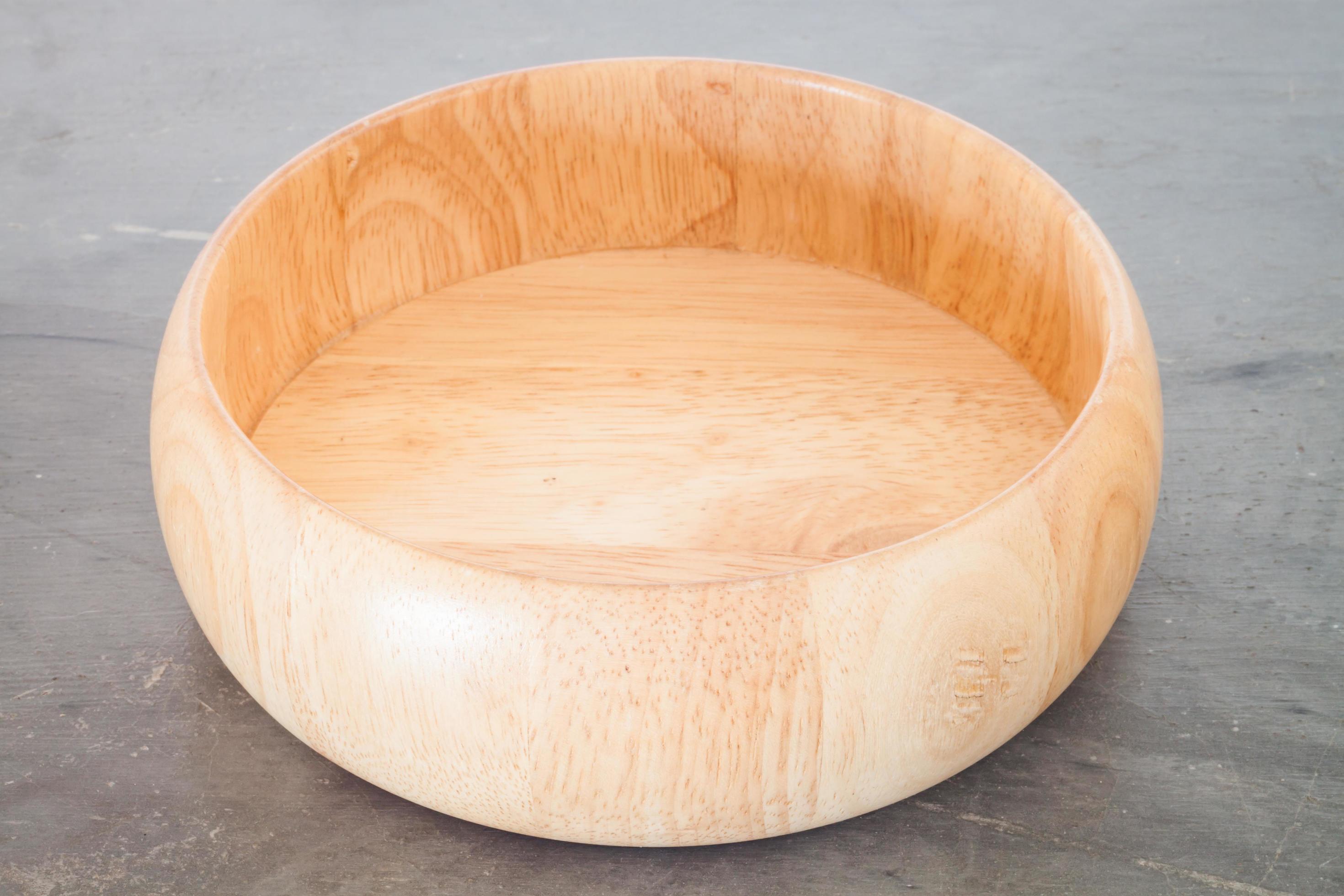 Wooden bowl on grey background 1759038 Stock Photo at Vecteezy