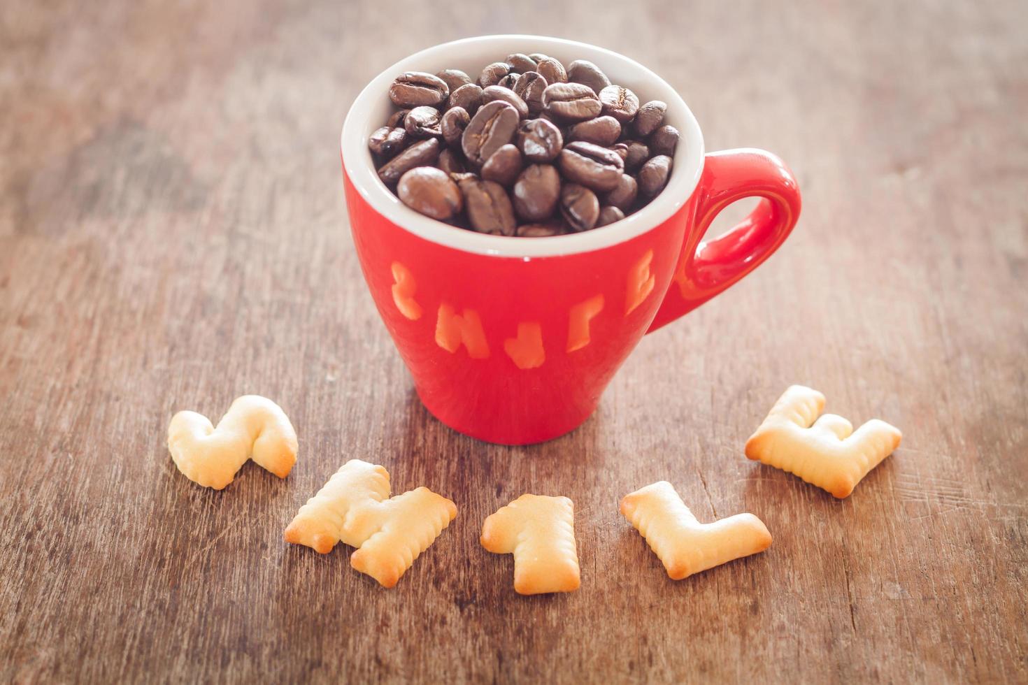 Smile alphabet biscuits with a red cup photo