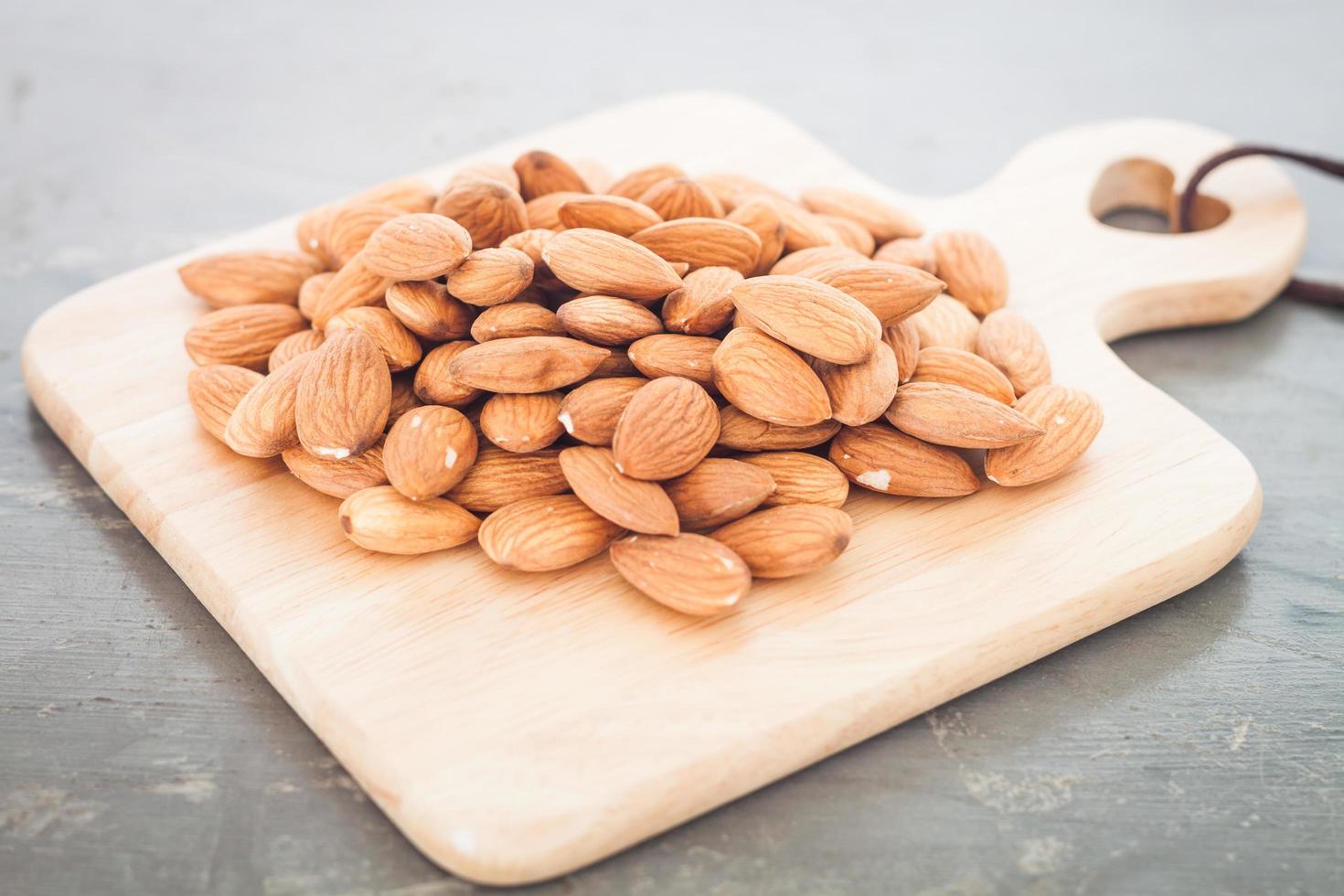 Almond nuts on a board photo