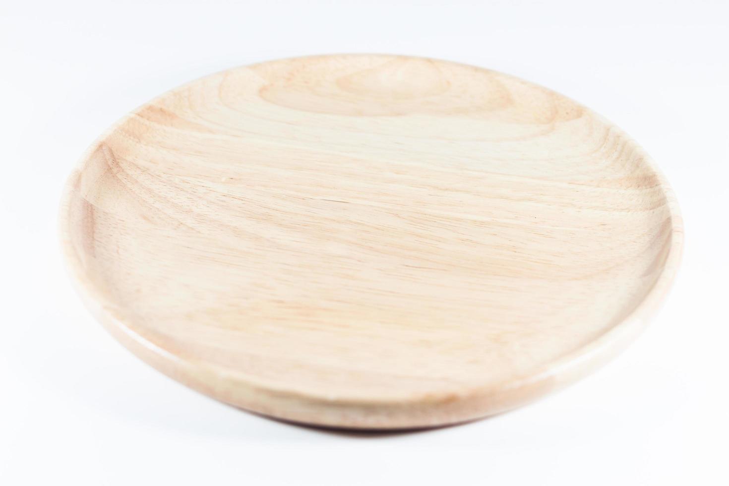 Wooden plate on a white background photo