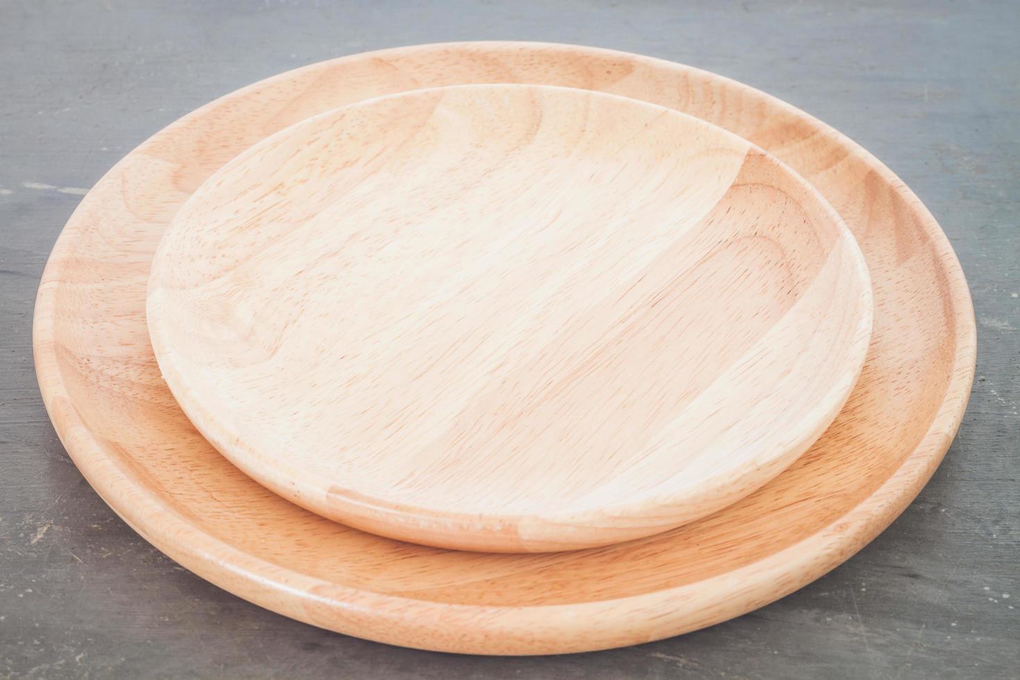 Wooden plates on a grey background photo