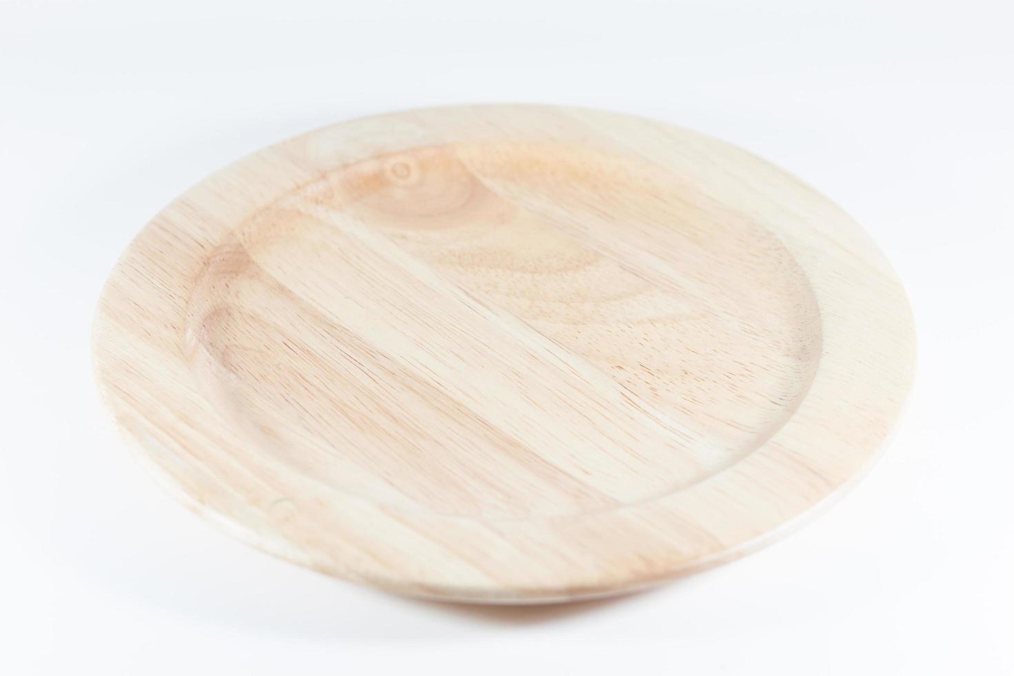 Wooden plate isolated on a white background photo