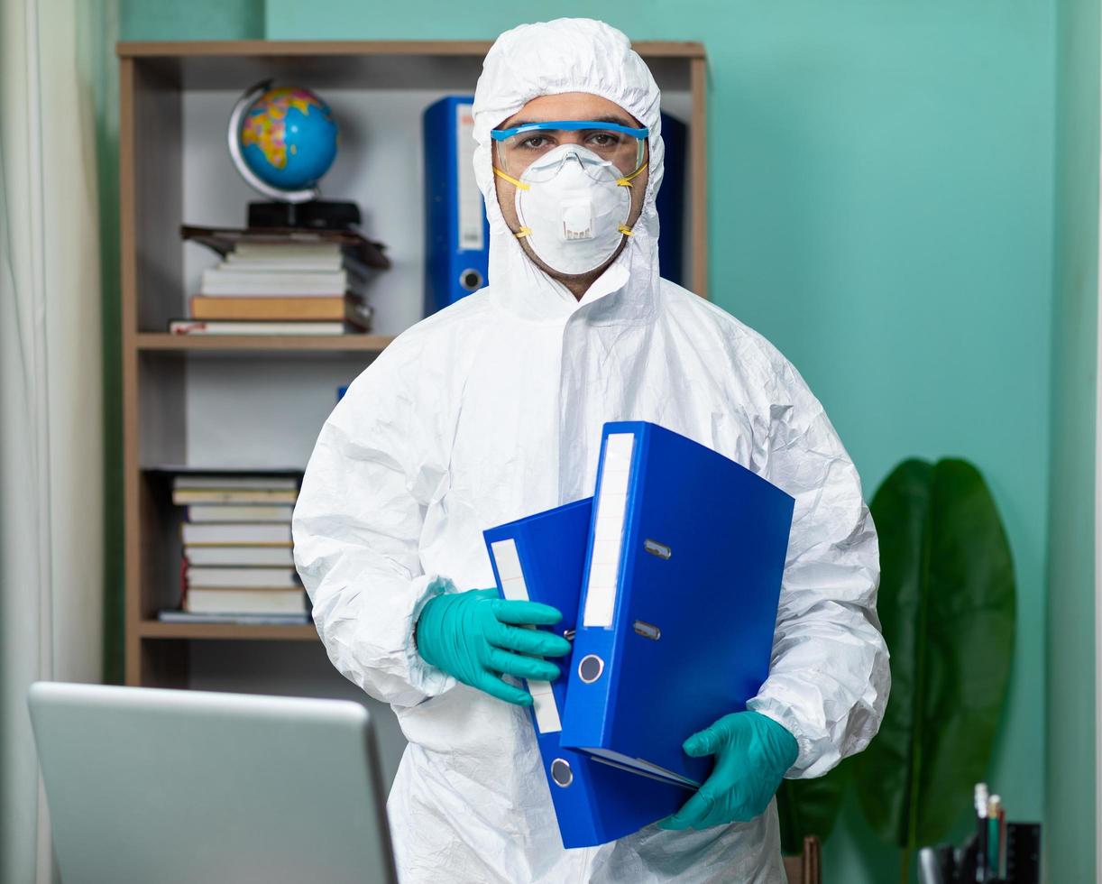 Person in protective suit at the office photo