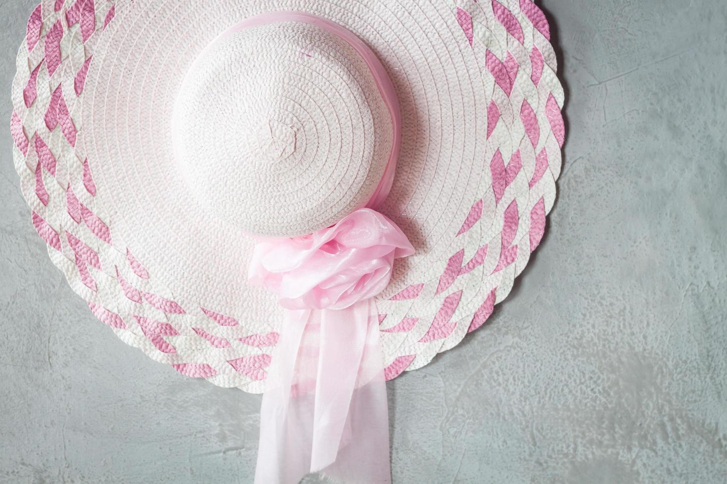 Pink hat on a grey background photo