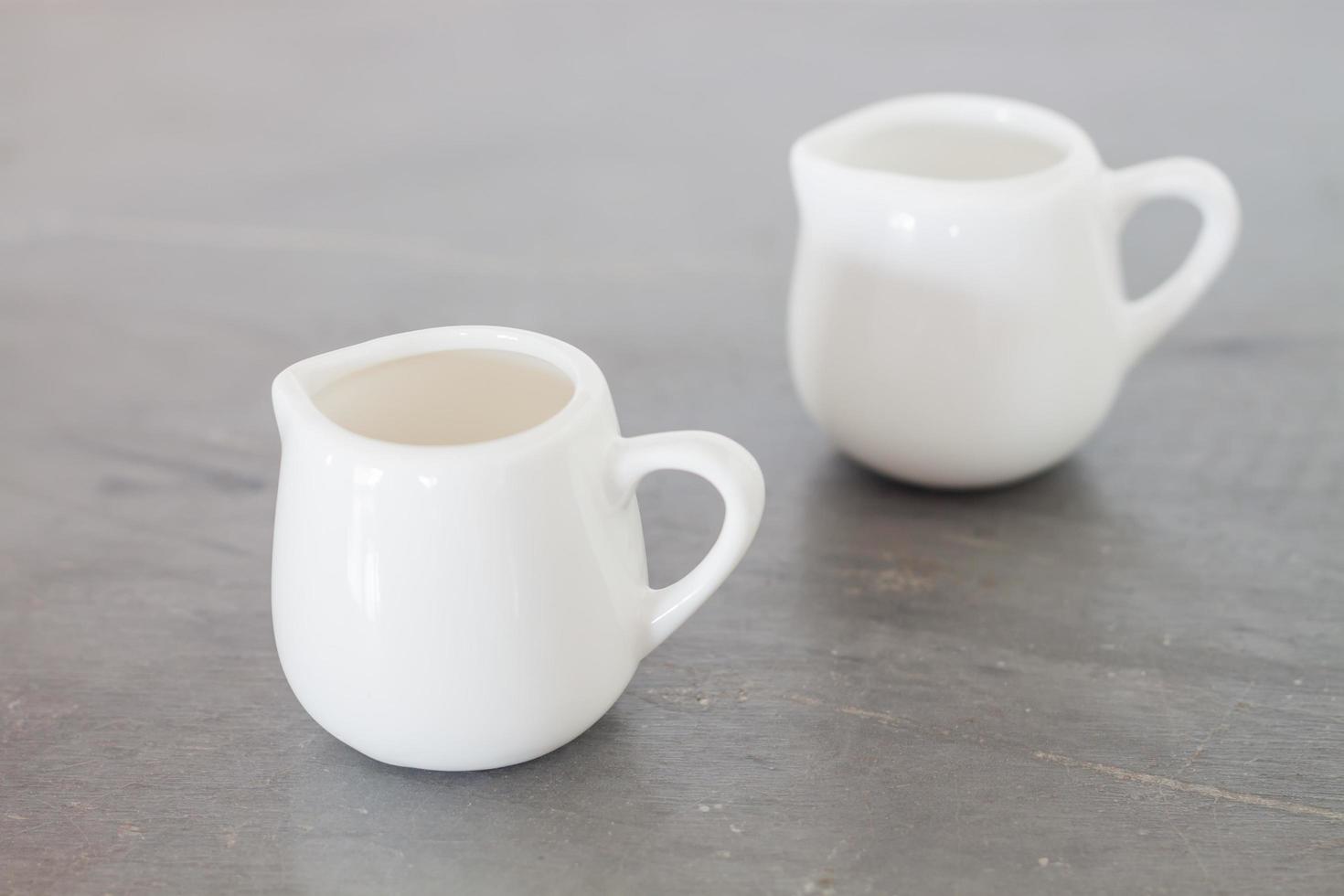 White ceramic pitchers photo