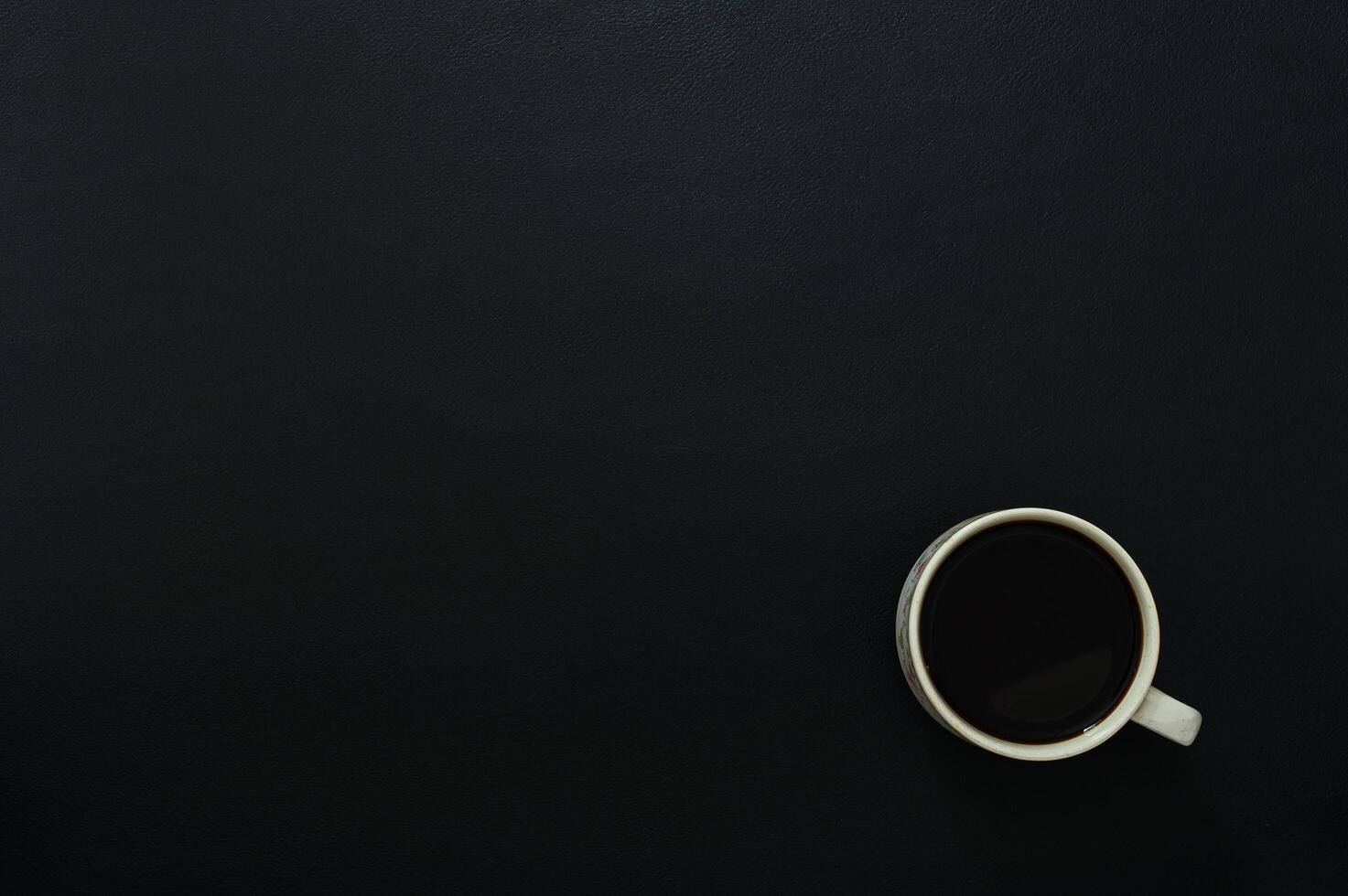 Black desk with coffee photo