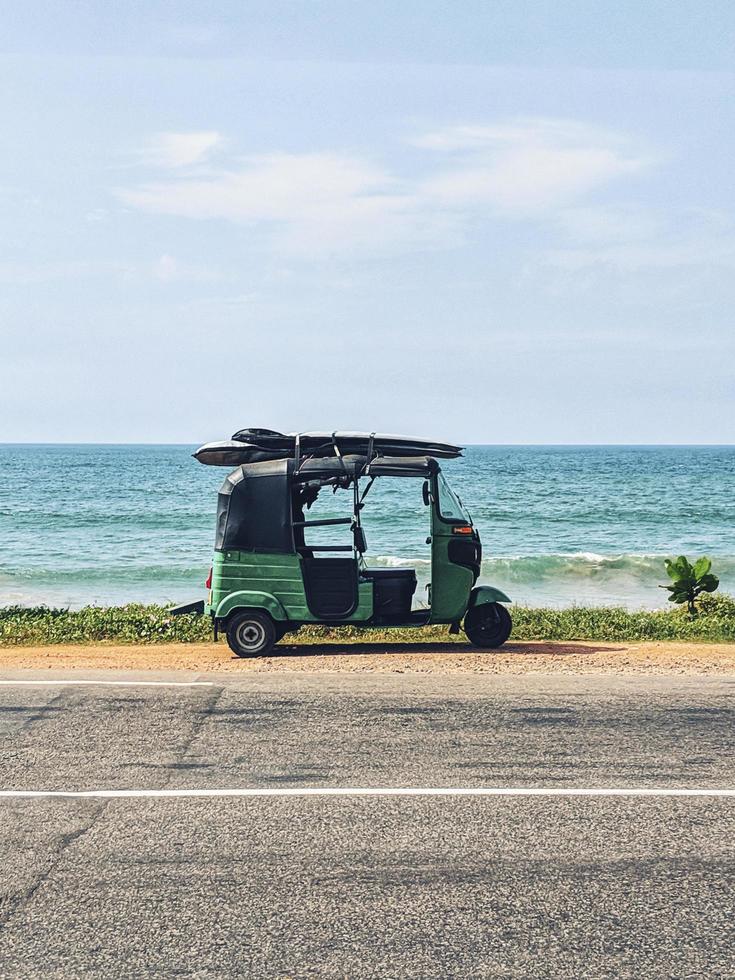 Sri Lanka, 2020 - Green gold cart on the side of a road photo