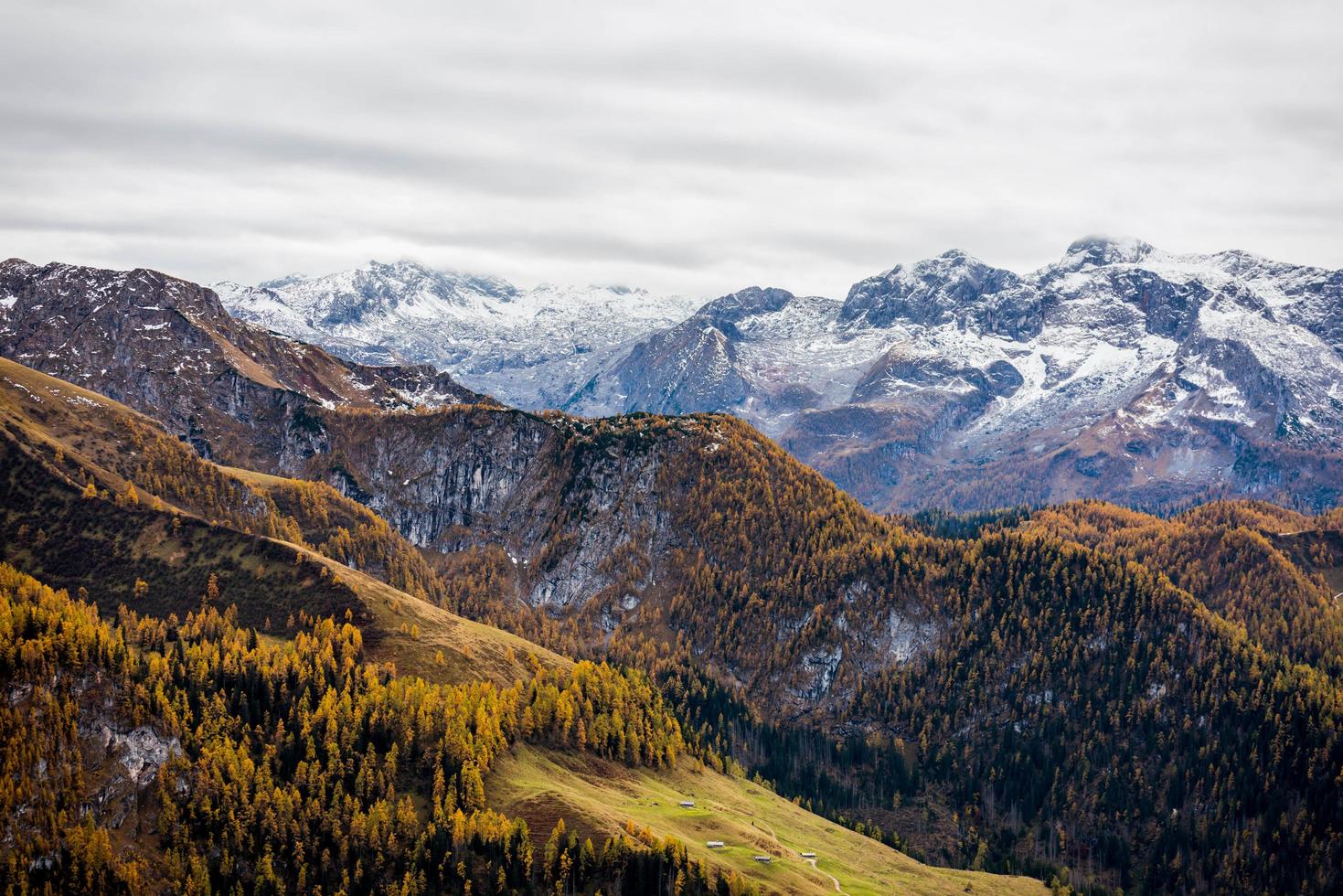 Green and brown mountains under white clouds photo