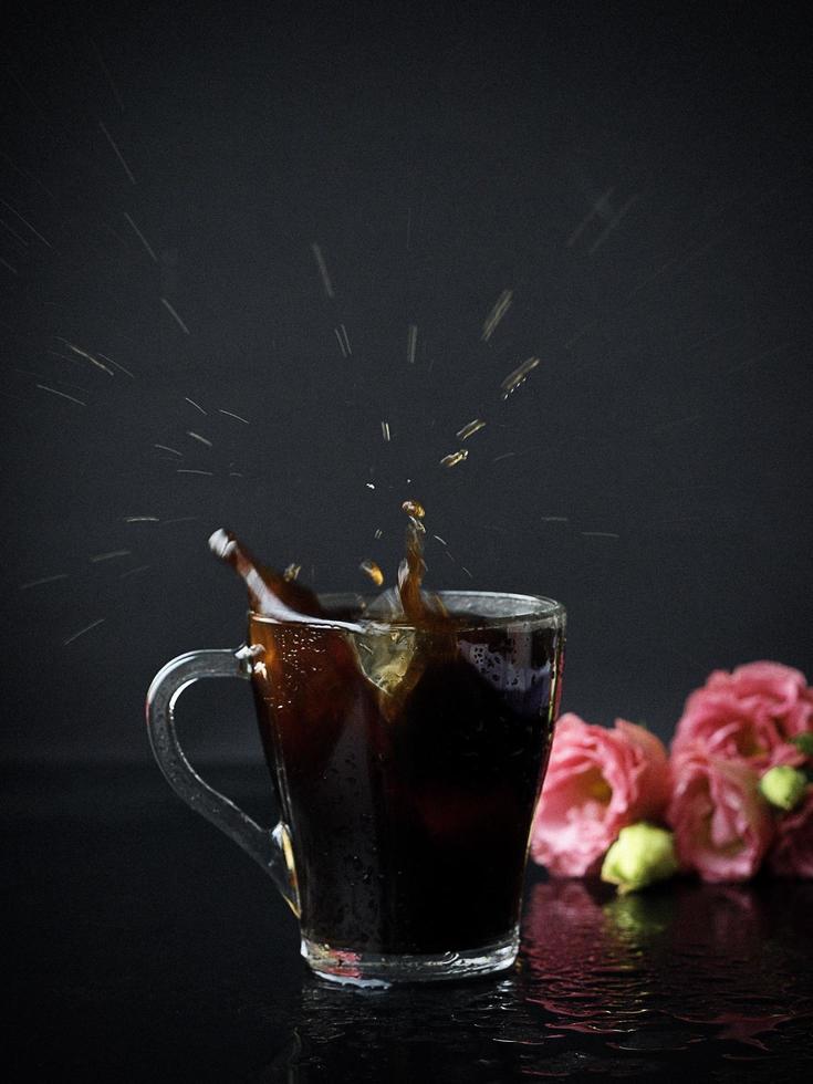 Coffee splash with flowers photo