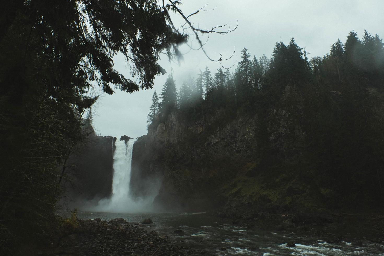 Waterfall with fog and trees photo