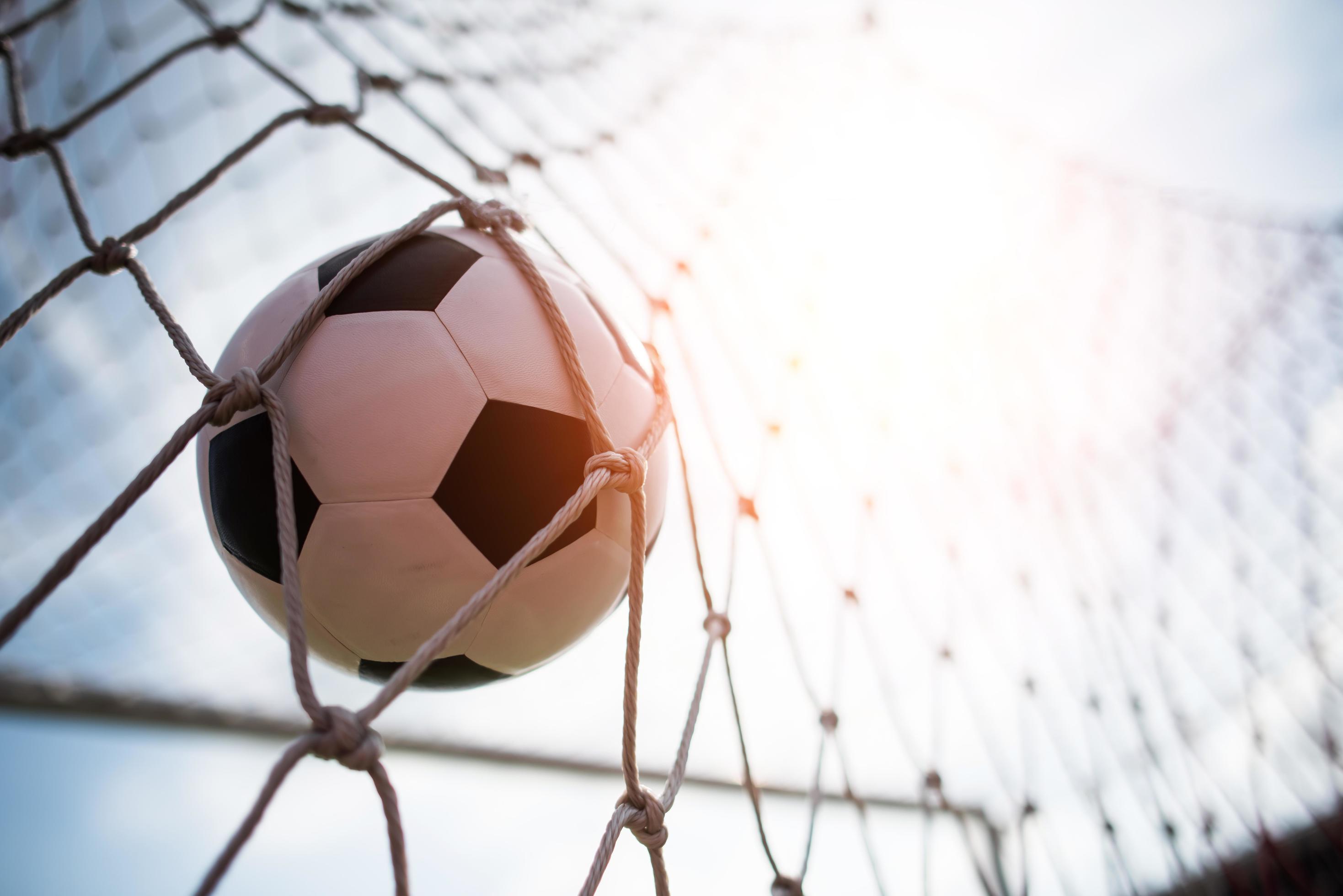 Soccer Ball Soars Into Goal Net Stock Photo At Vecteezy
