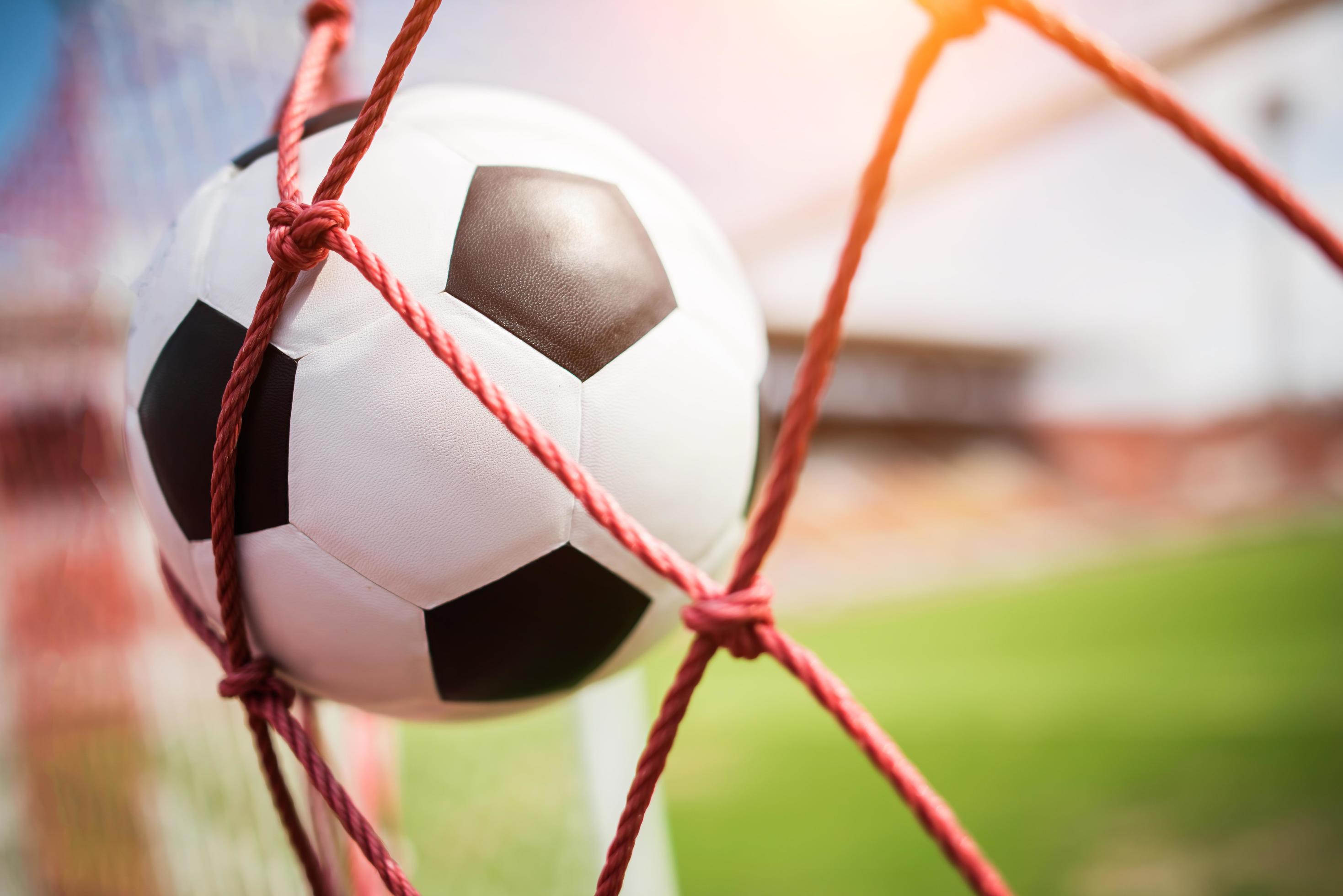 Soccer Ball Soars Into Goal Net Stock Photo At Vecteezy