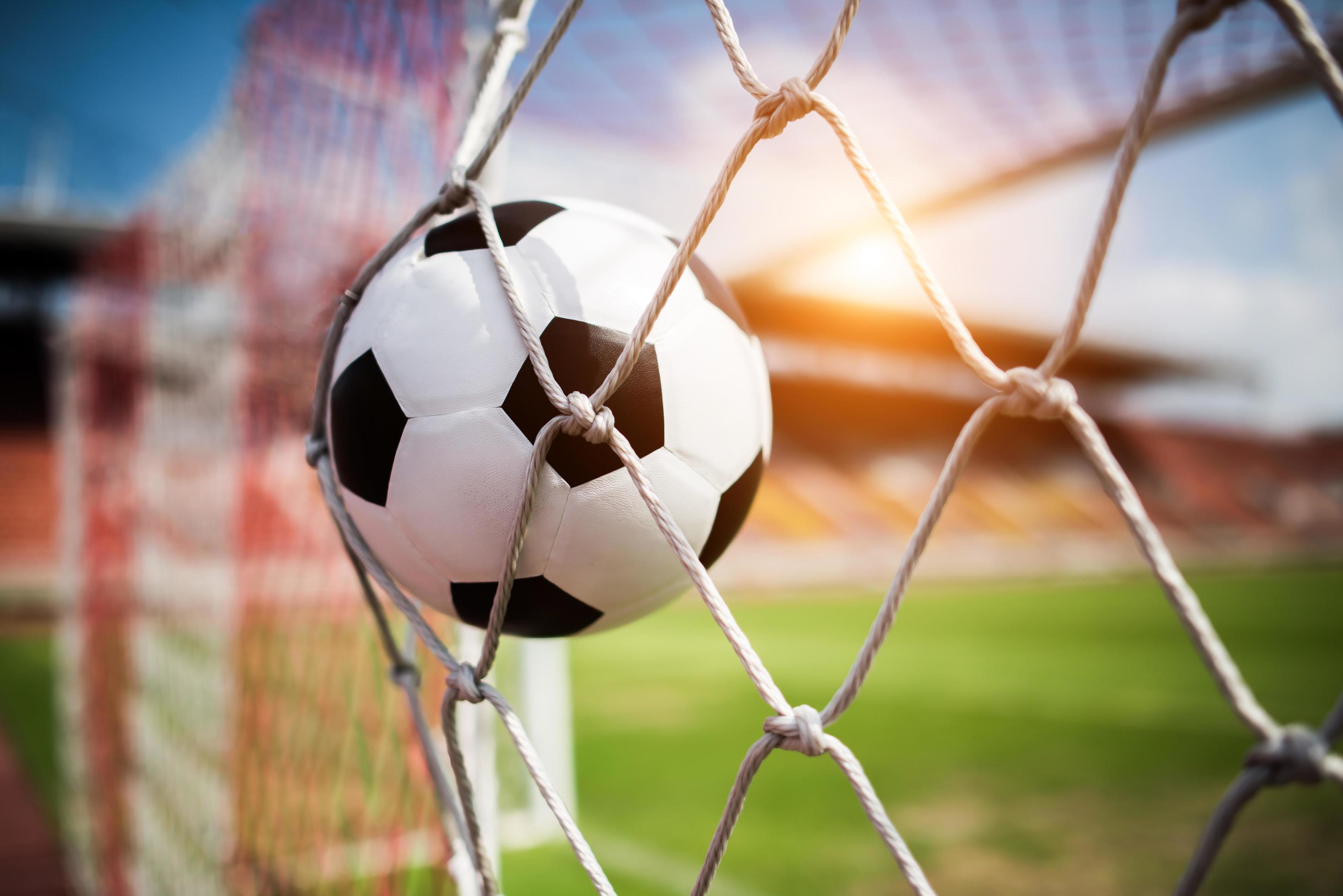 Soccer Ball Soars Into Goal Net Stock Photo At Vecteezy