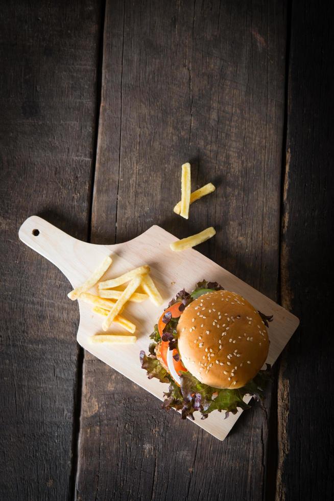 Top view of rustic homemade hamburger and french fries photo