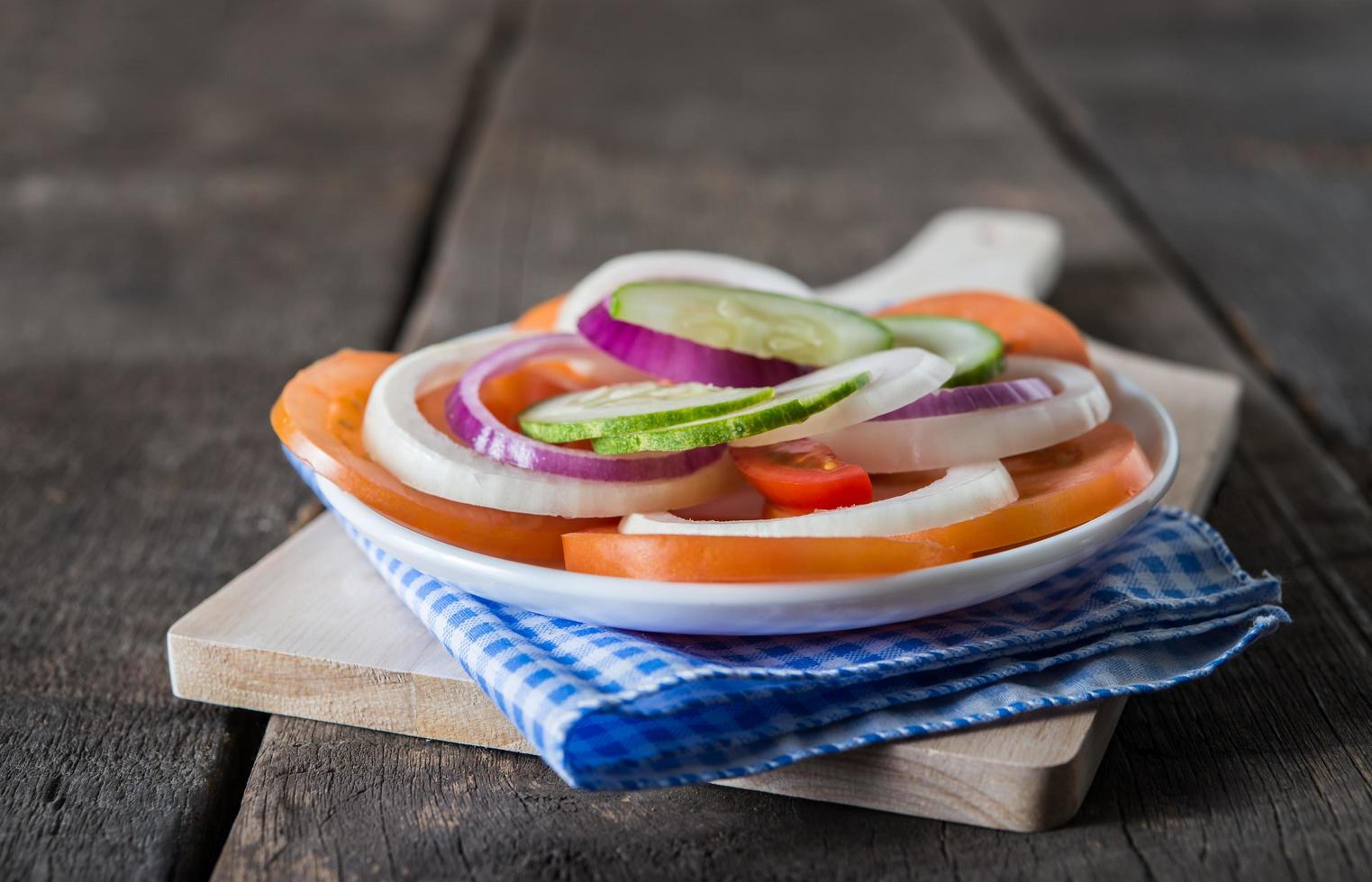 Fresh vegetables on wooden background photo