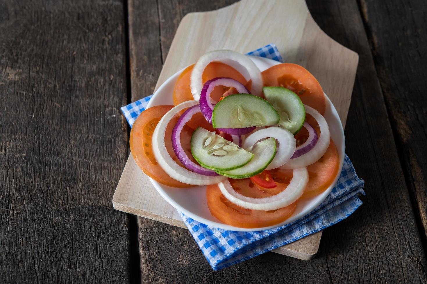 Fresh vegetables on wooden background photo