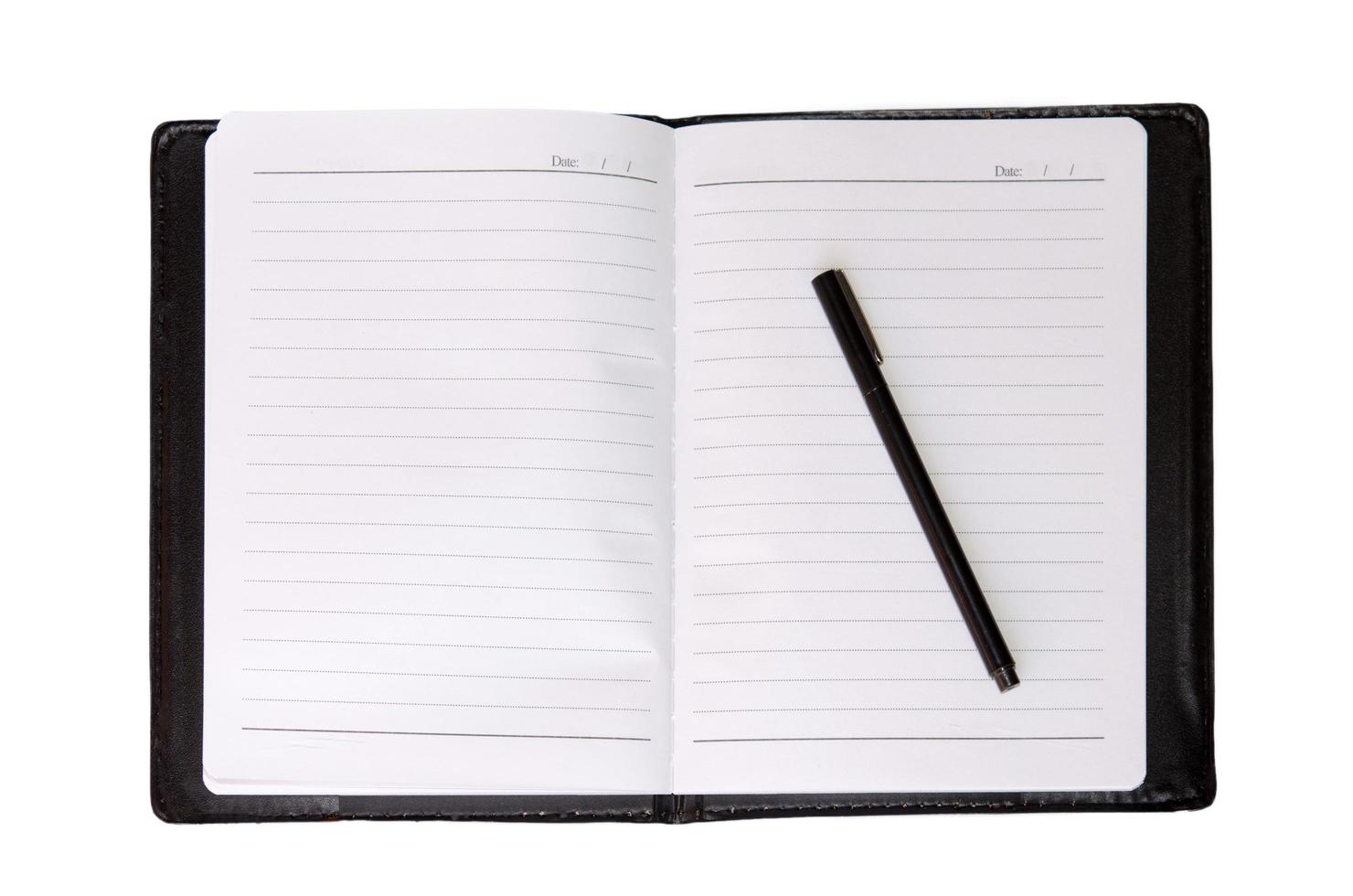 Top view of a notebook and pen photo