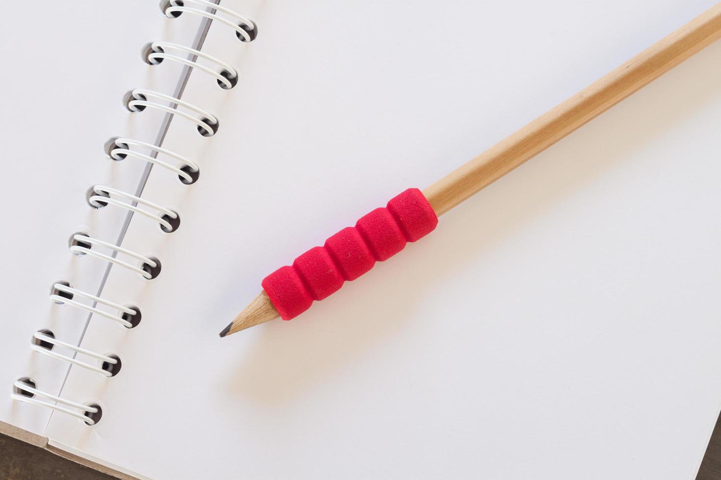 Close-up of a pencil on a notebook photo