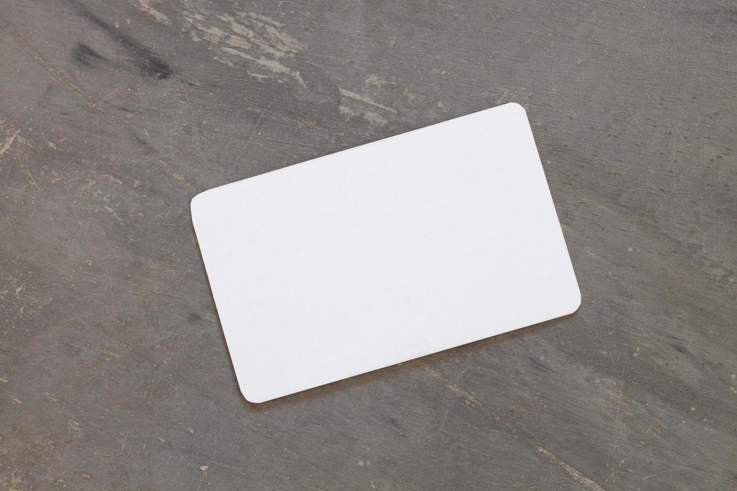 Business card on a grey background photo