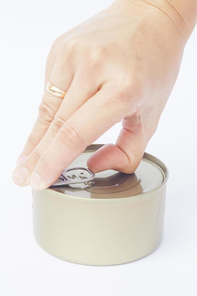 Hand opening a can photo