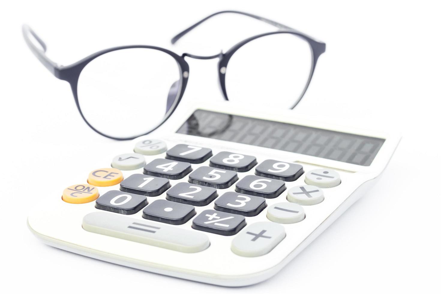 Calculator with eyeglasses photo