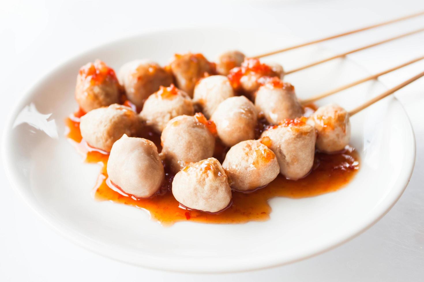 Pork balls on skewers photo