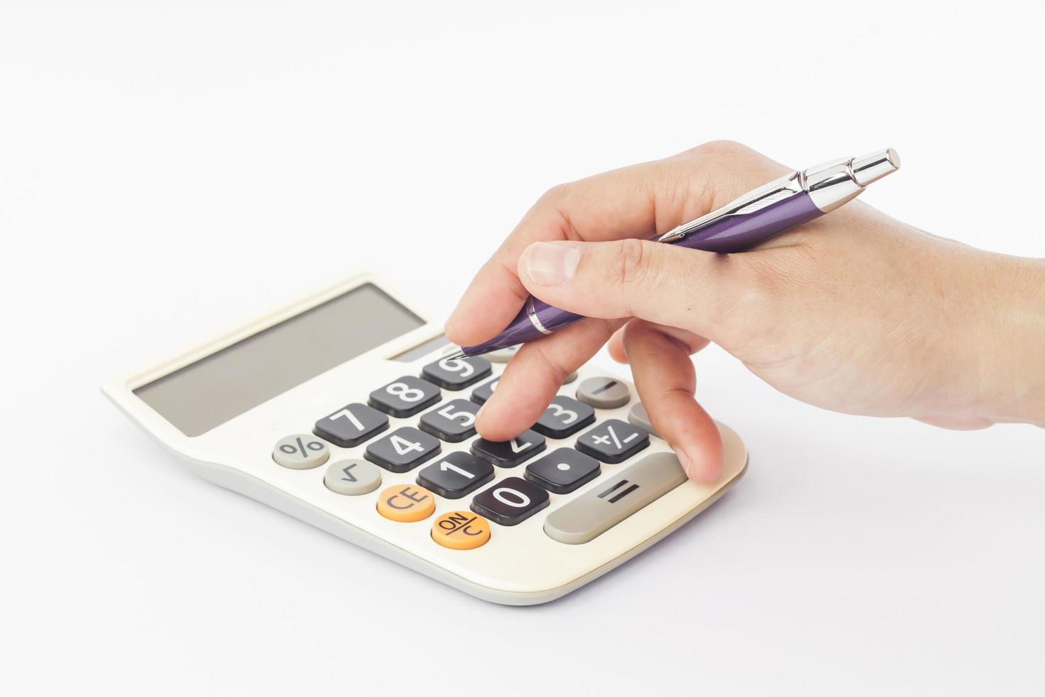 Close-up of a hand on a calculator photo