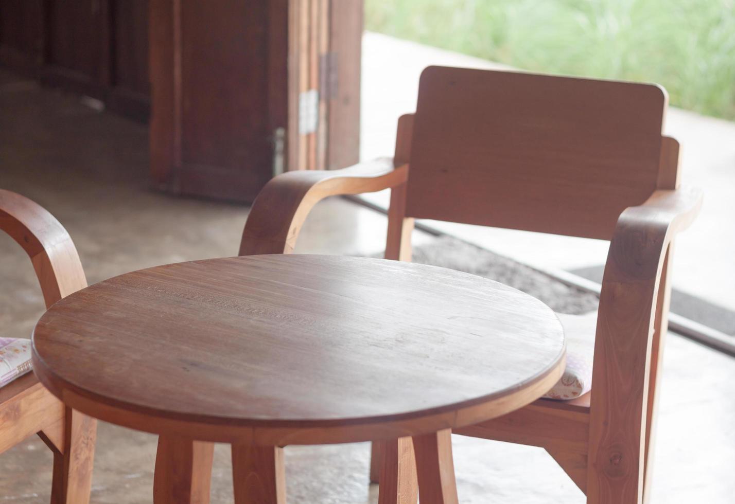 Wooden table and chairs in a cafe photo