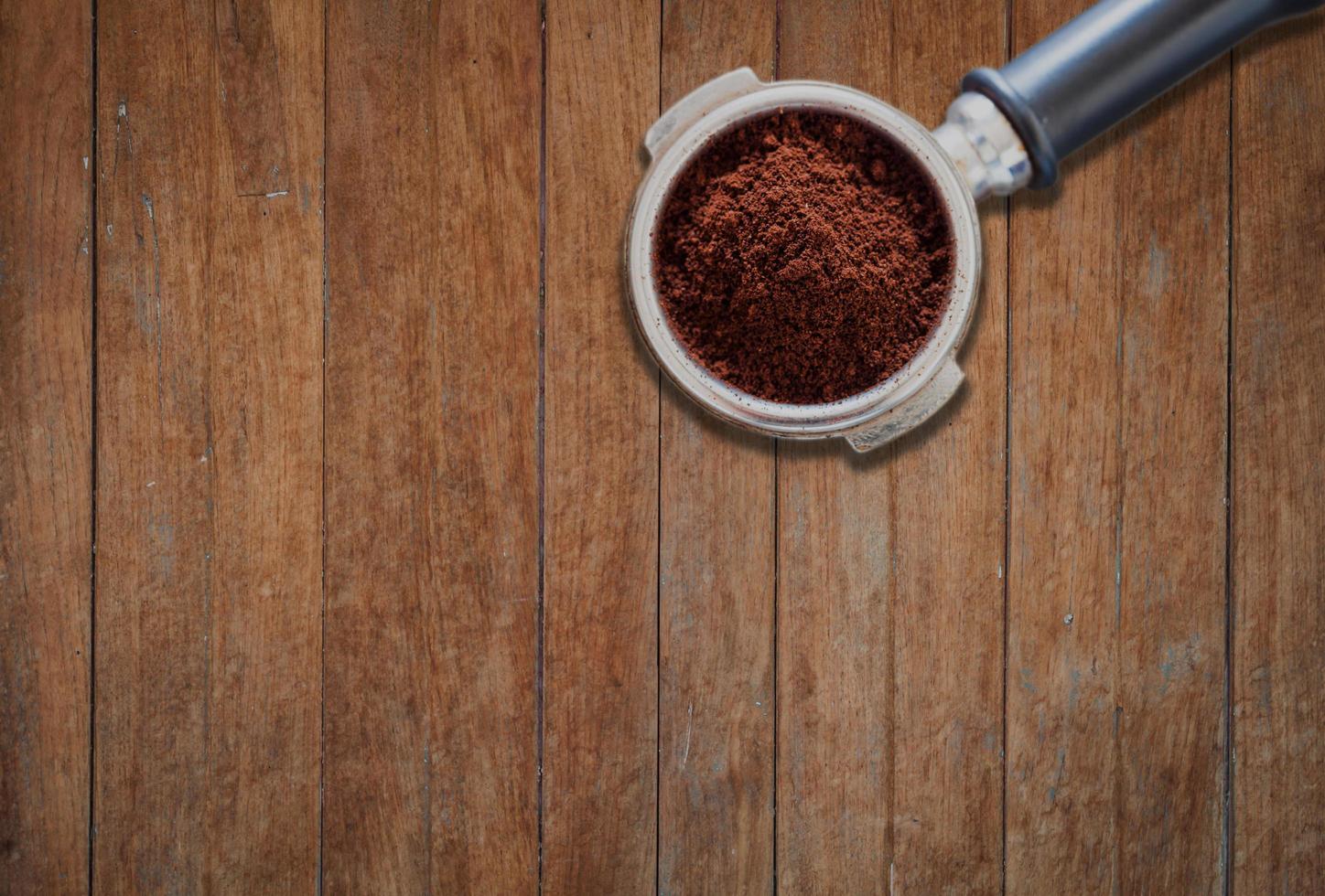 Coffee grinder on a wooden background photo