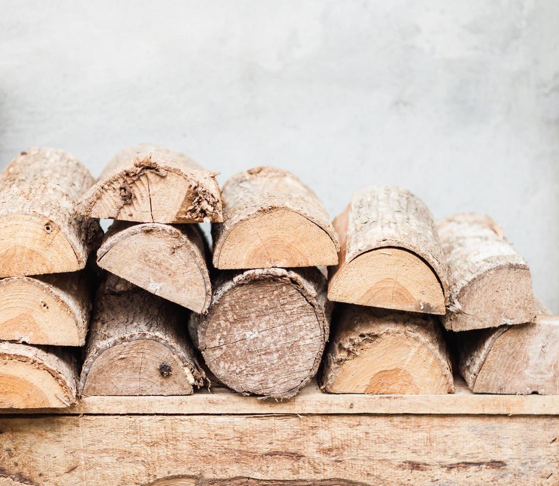 Stacked firewood on a table photo