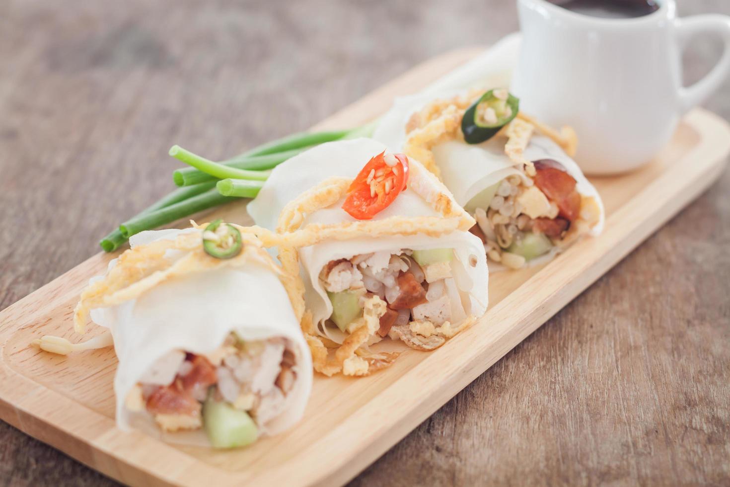 Close-up of spring rolls on a table photo