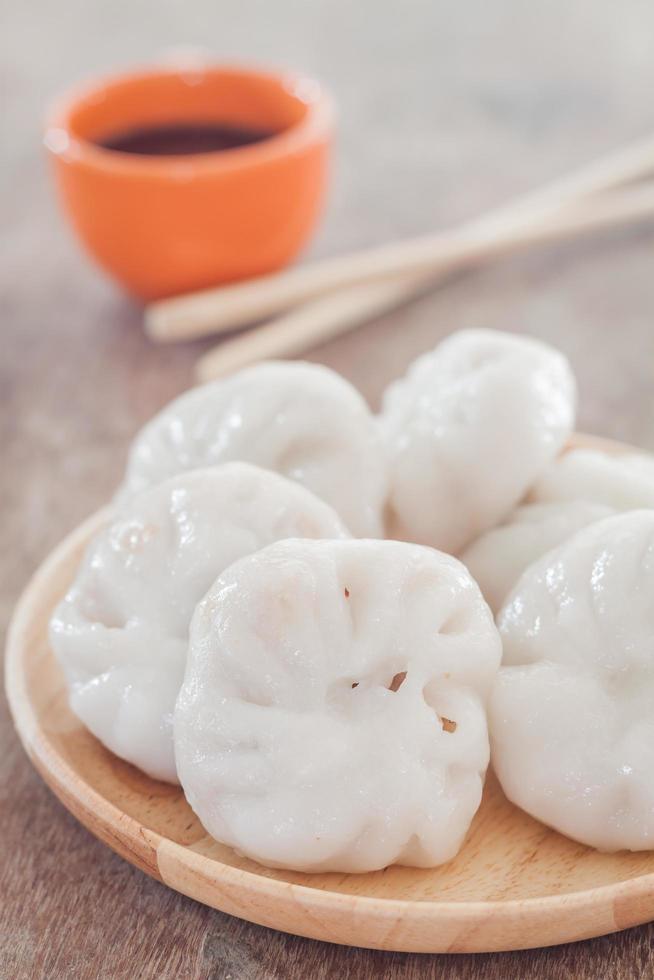 Close-up of dim sum and chopsticks photo