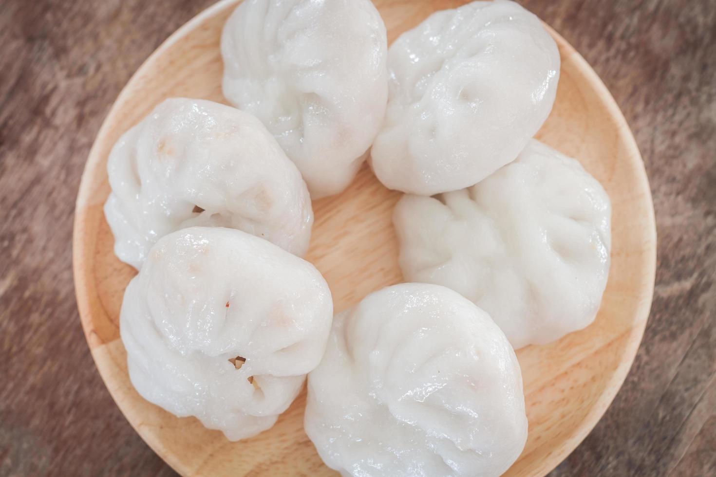 Close-up of dim sum on a wooden plate photo