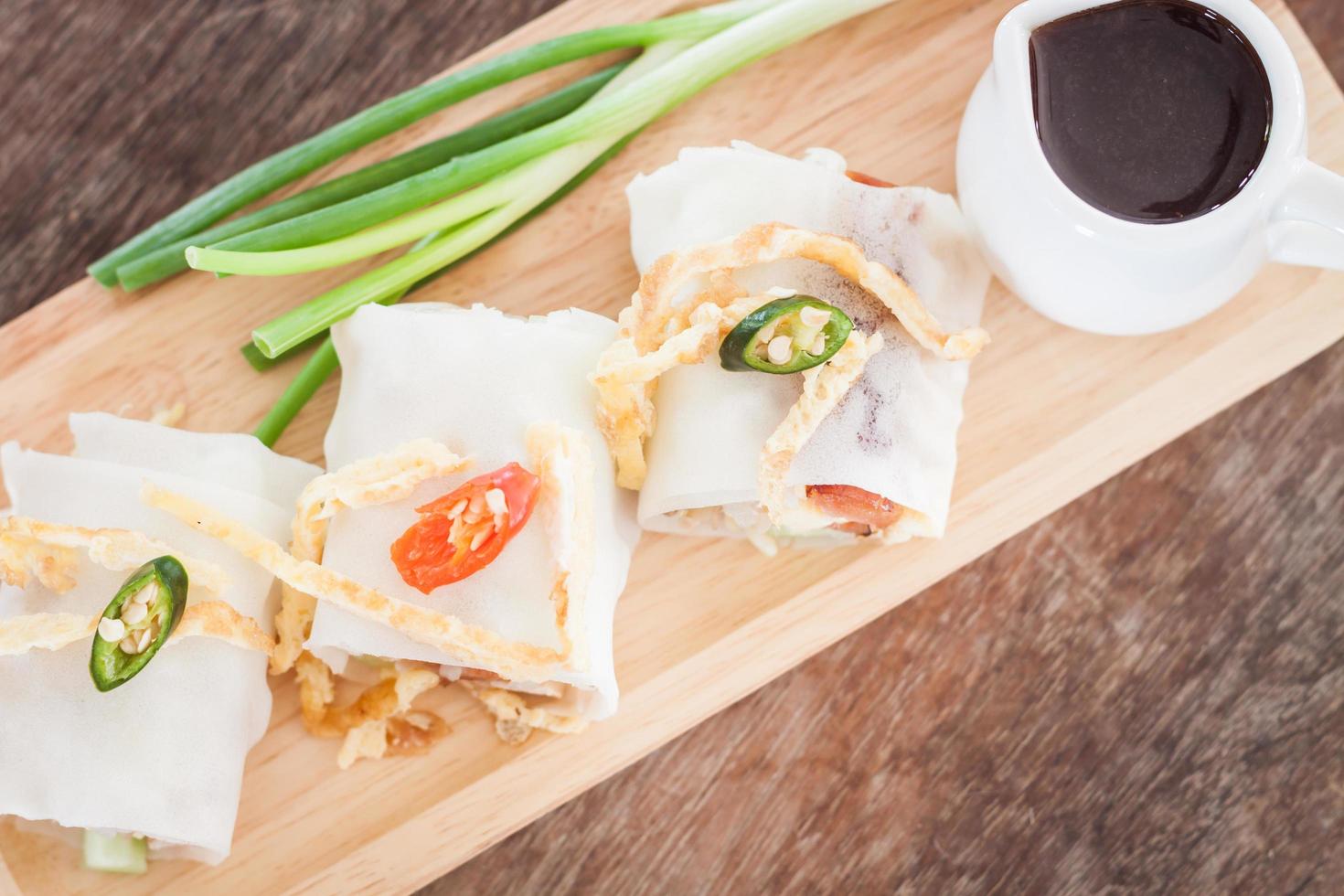 Top view of spring rolls and sauce photo