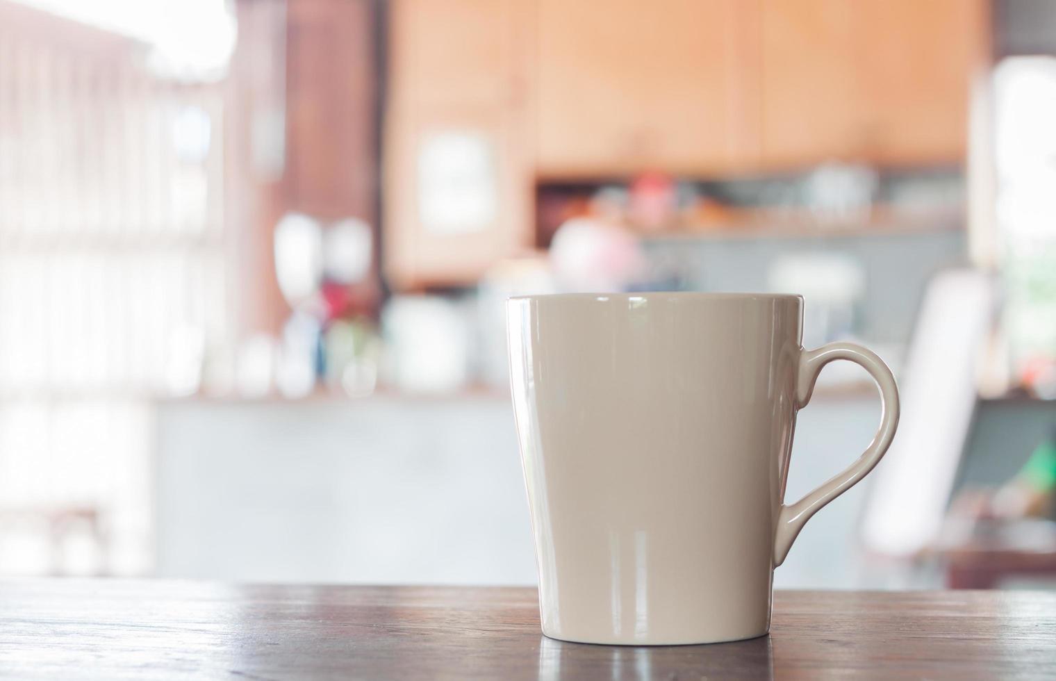 Beige coffee cup in a cafe photo