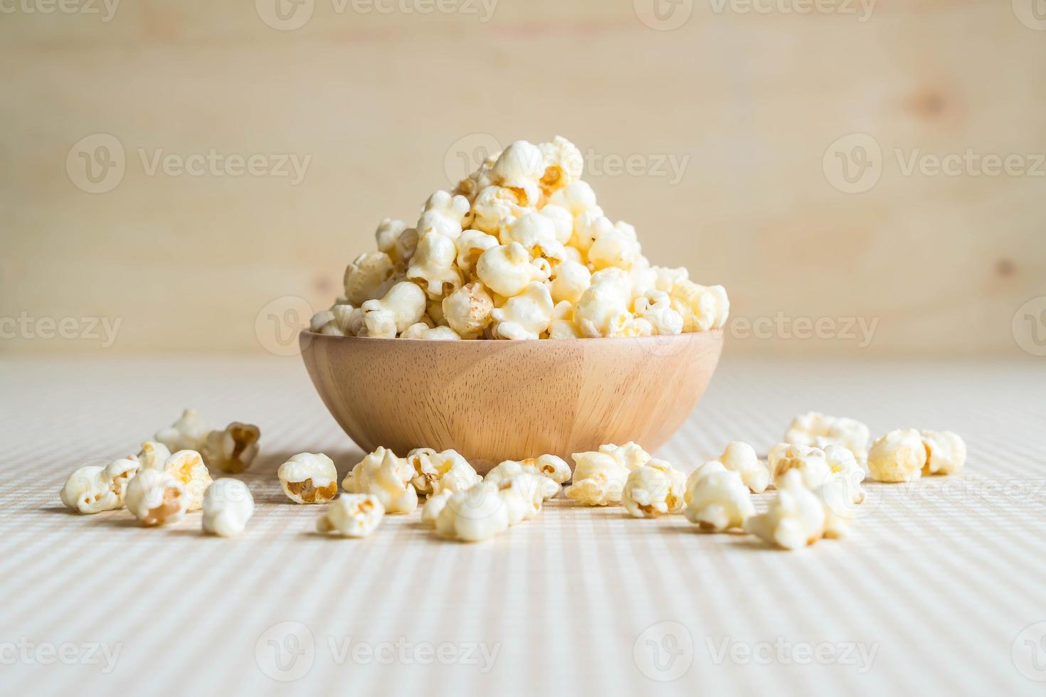 Bowl of caramel popcorn on the table photo