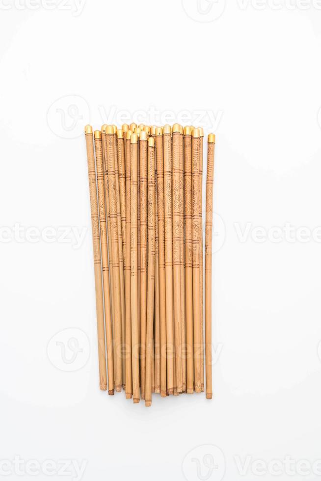 Bamboo chopsticks on white background photo