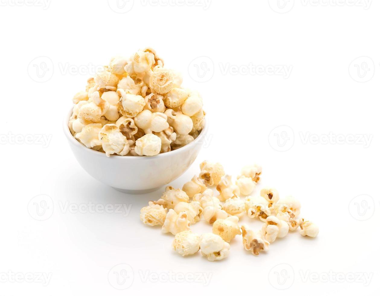 Caramel popcorn on white background photo