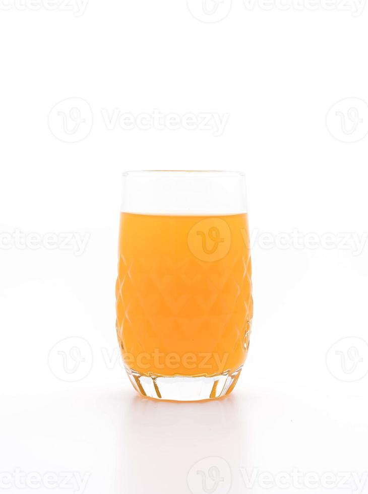 Glass of orange juice on white background photo