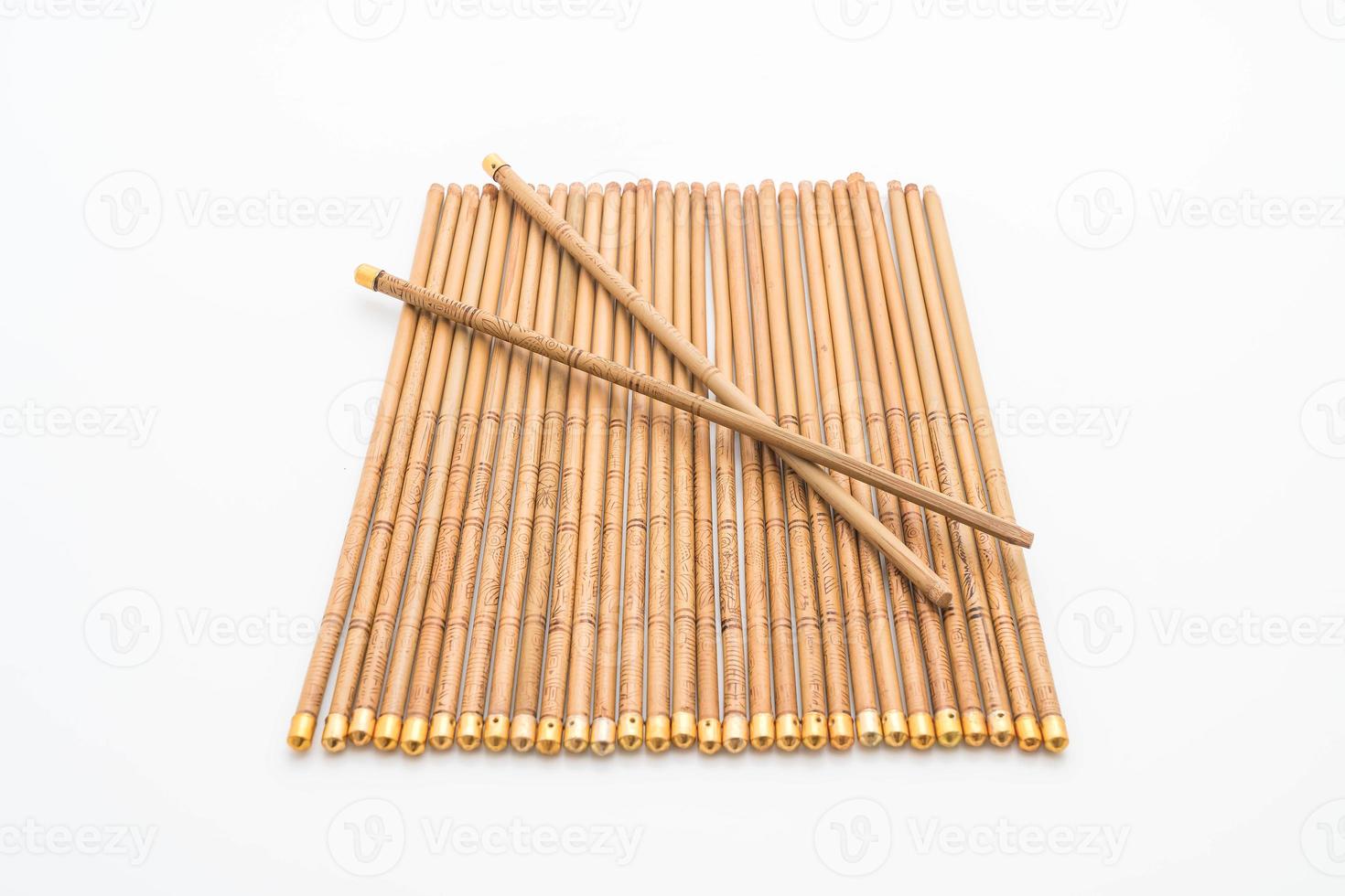 Bamboo chopsticks on white background photo